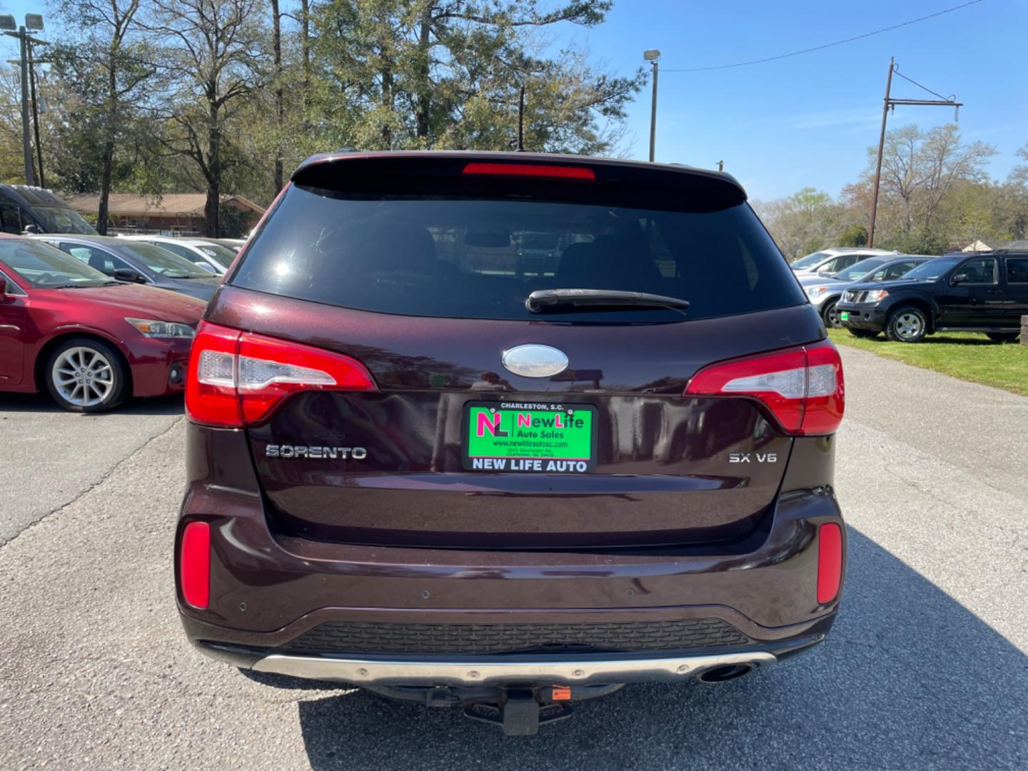 2015 PLUM KIA SORENTO SX (5XYKW4A77FG) with an 3.3L engine, Automatic transmission, located at 5103 Dorchester Rd., Charleston, SC, 29418-5607, (843) 767-1122, 36.245171, -115.228050 - Local Trade-in with Leather, Panoramic Sunroof, Navigation, Backup Camera, CD/AUX/Sat/Bluetooth, Dual Climate Control, Power Everything (windows, locks, seats, mirrors), Heated/Cooled/Memory Seating, Power Liftgate, Convenient Third Row, Push Button Start, Keyless Entry, Alloy Wheels. Certified One - Photo#5